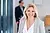 Professionelles Porträt der Mitarbeiterin Frau Gerrath lächelnd in einem modernen Büro, im Vordergrund, mit unscharfem Hintergrund einer Person im Anzug. Professionelles Porträt der Mitarbeiterin Frau Gerrath lächelnd in einem modernen Büro, im Vordergrund, mit unscharfem Hintergrund einer Person im Anzug.